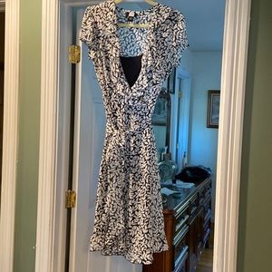 This is a cute flirty dress has side zip and a full black slip dress underneath.